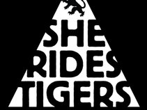 SHE RIDES TIGERS